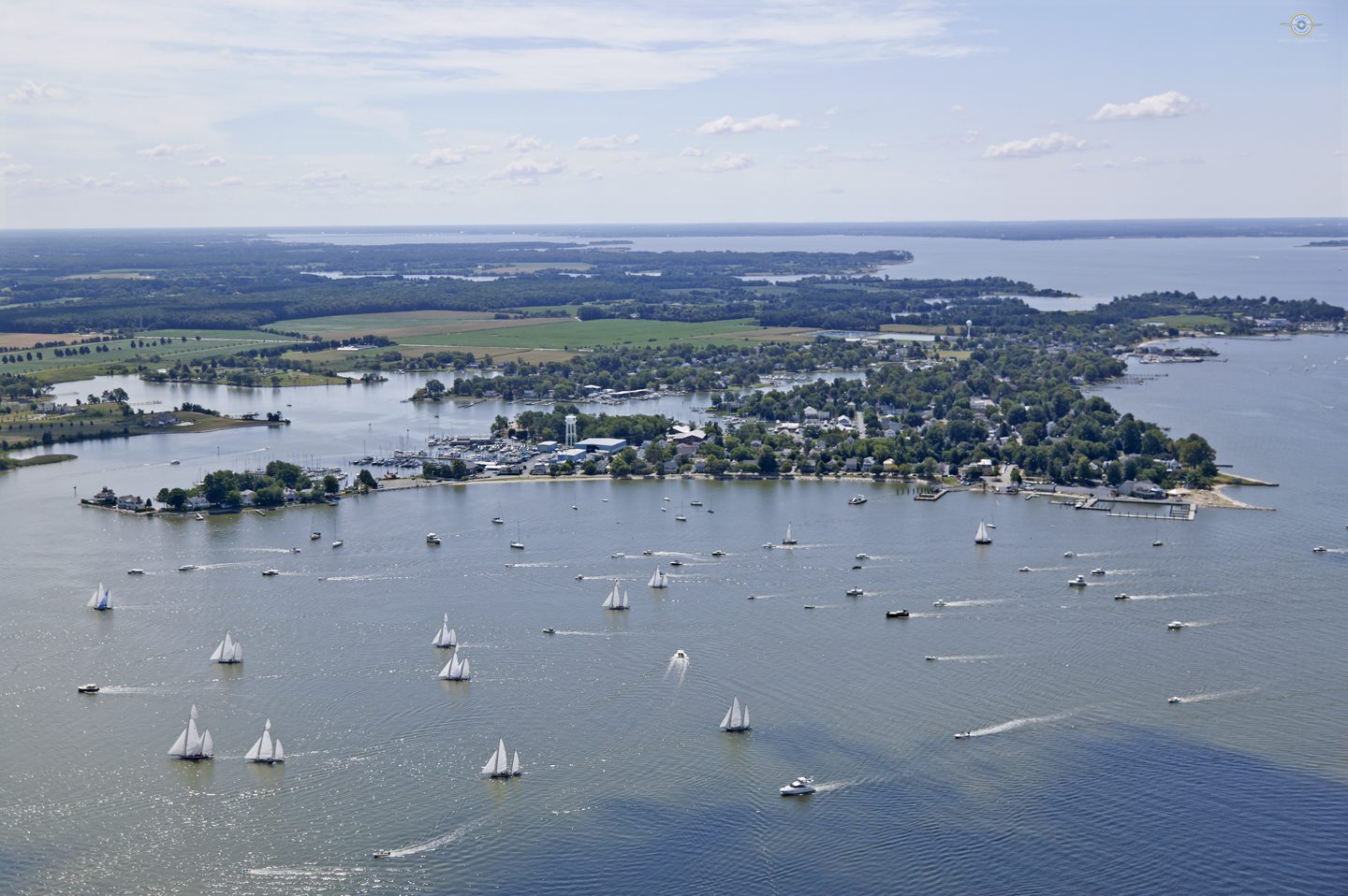 A large body of water with many small boats in it.